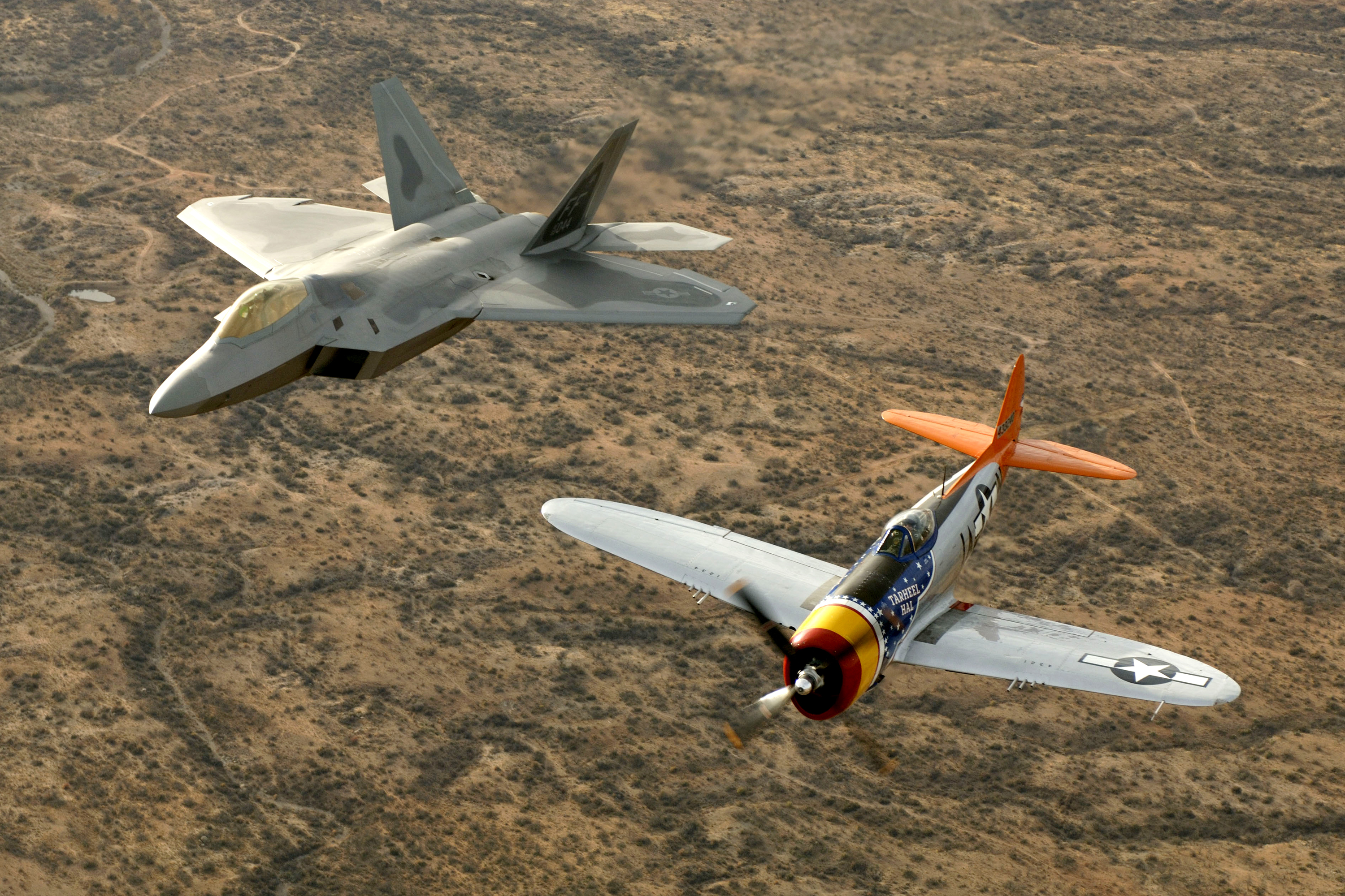 Heritage flight US heavy fighters: Advanced tactical fighters of two eras, the F-22 and the P-47.