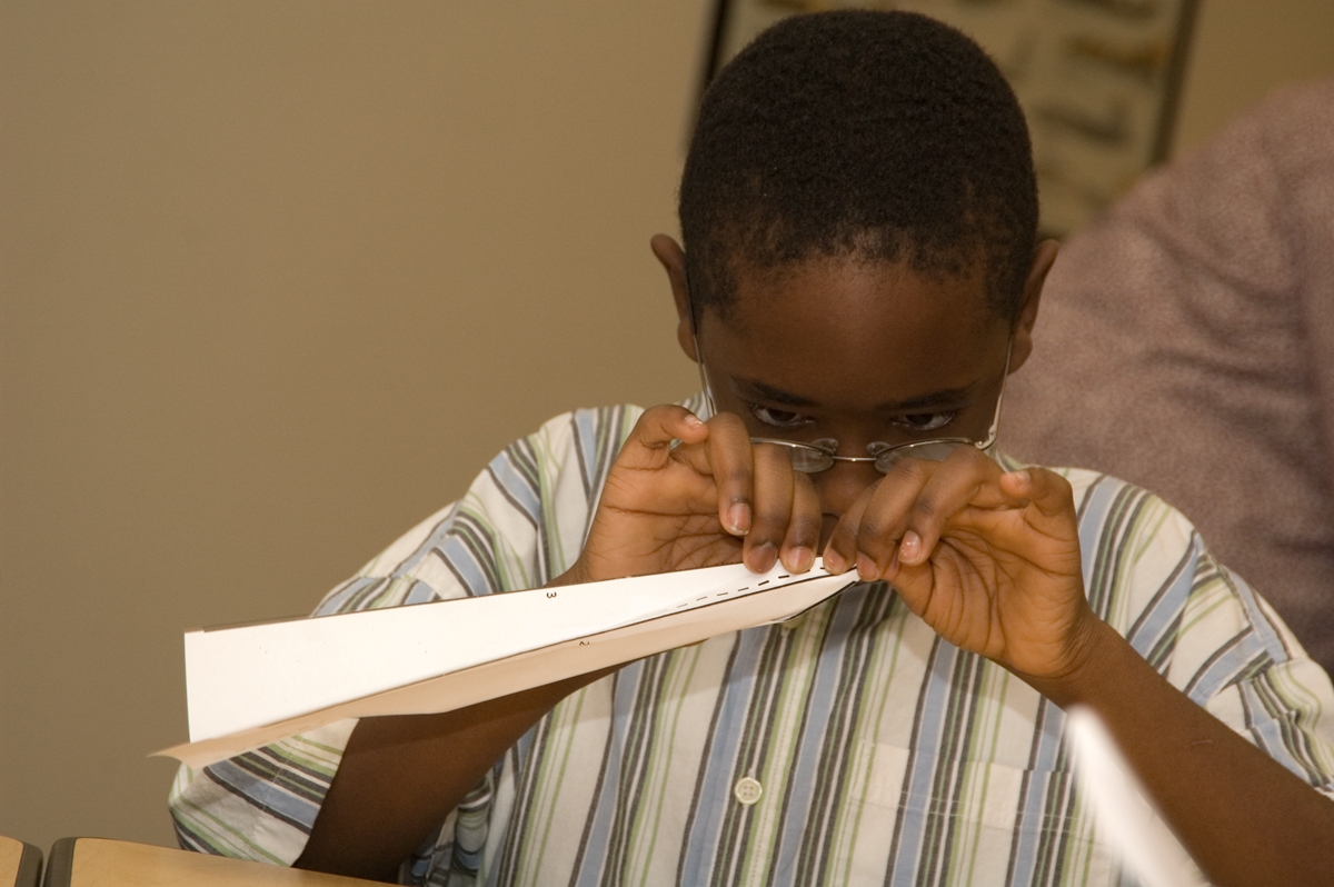 Boy-with-Paper-Airplane