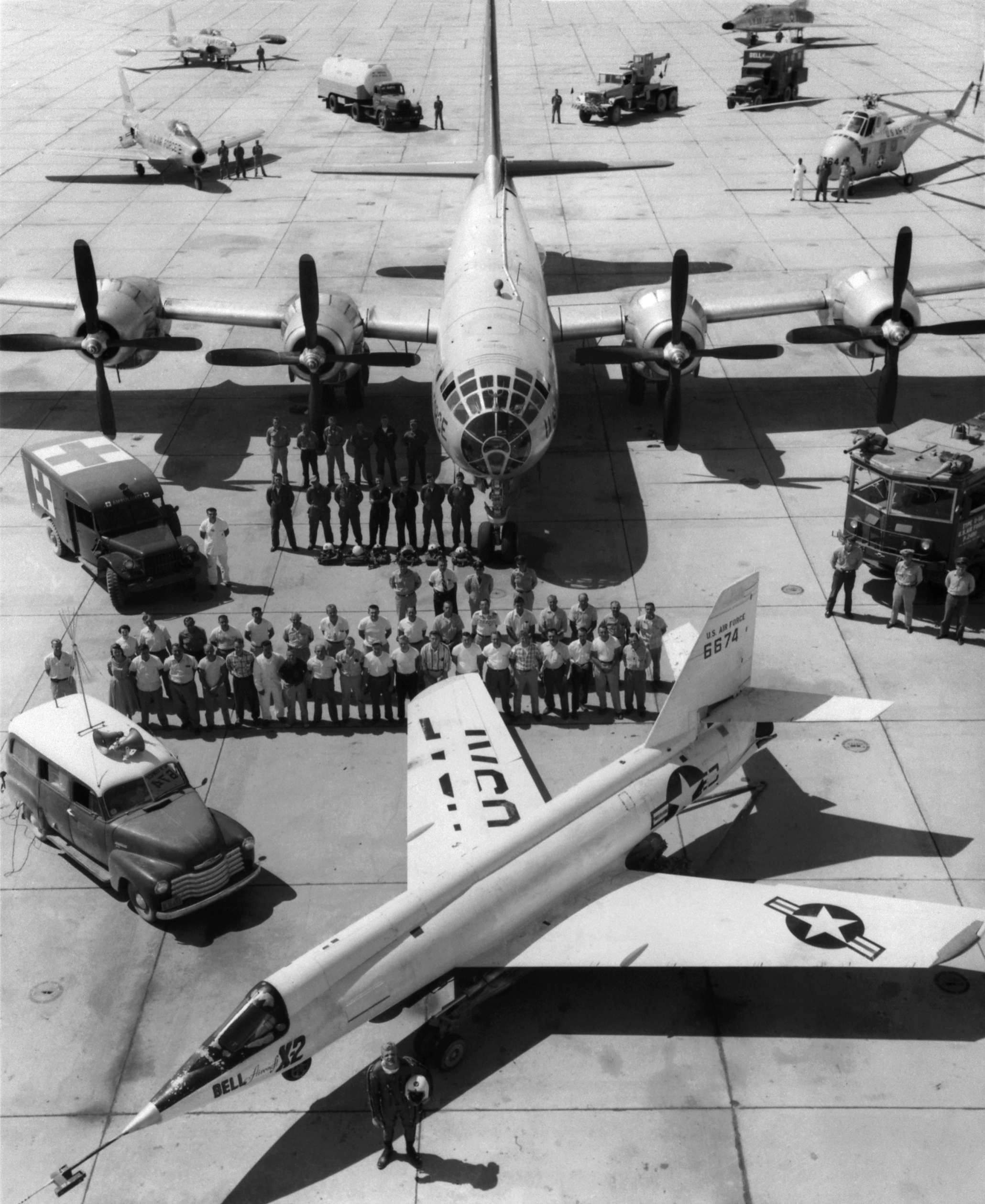X-2_on_ramp_with_B-50_mothership_and_support_crew.jpg